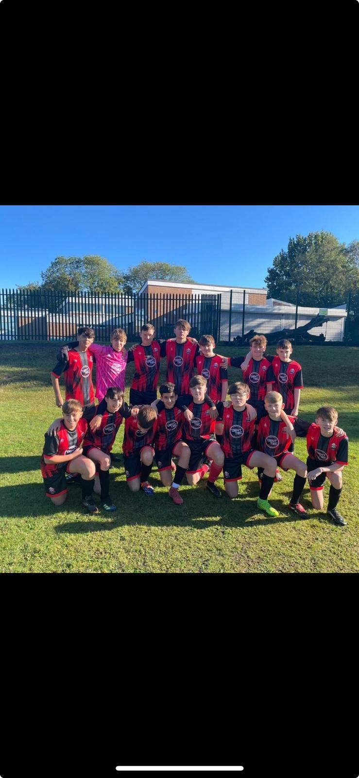 Youth football team in red and black 22 Unite kit