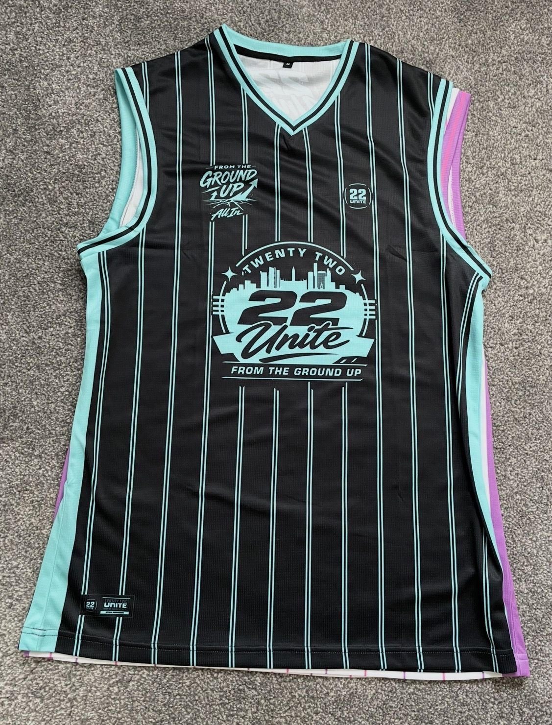 Black and mint pinstripe 22 Unite basketball vest from the Ground Up collection