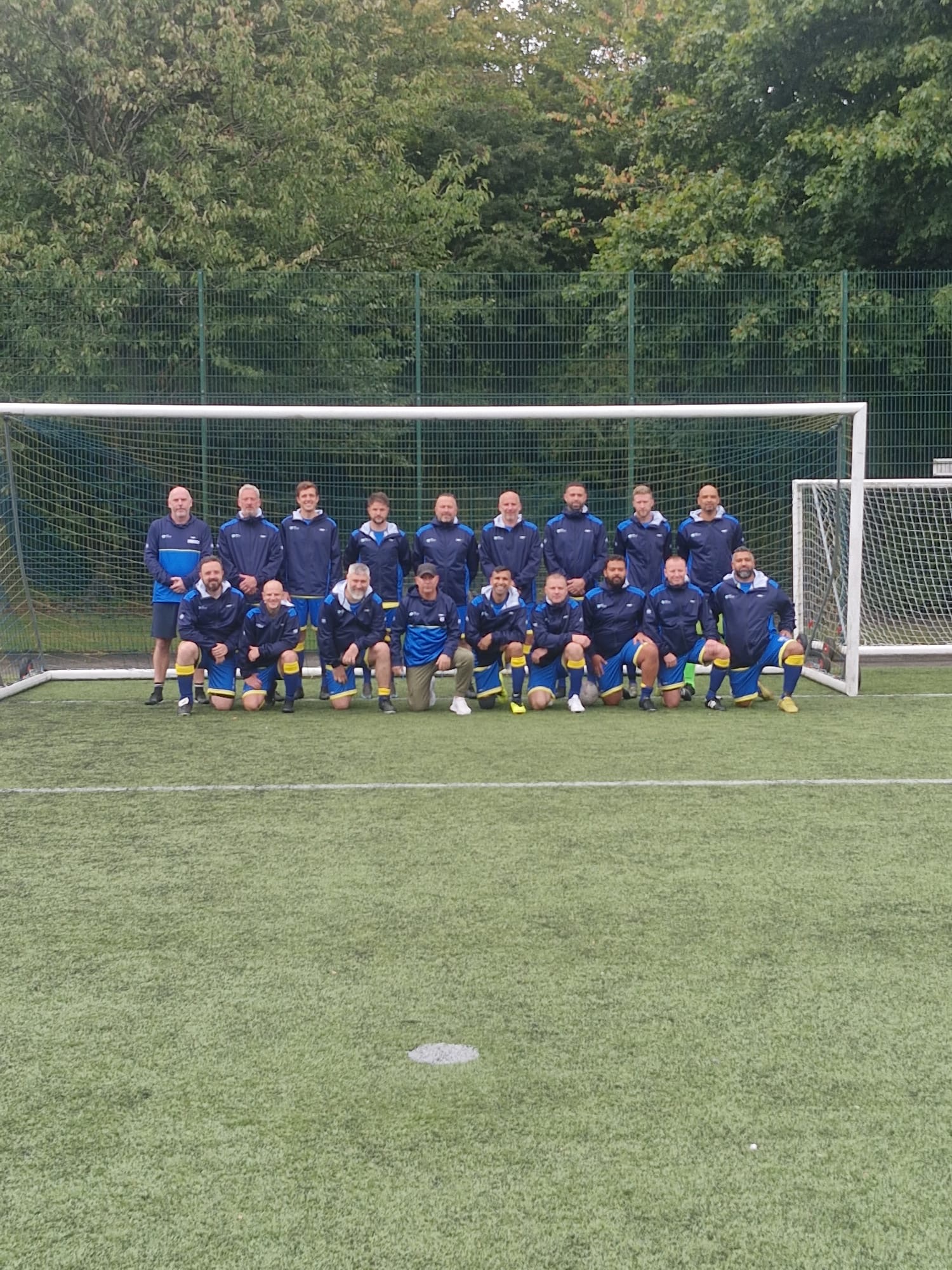 Football team in navy 22 Unite jackets