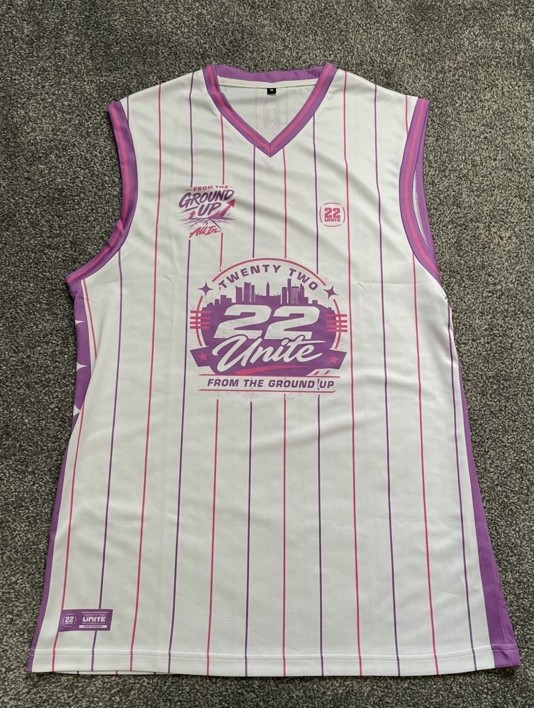 White and purple pinstripe 22 Unite basketball vest from the Ground Up collection